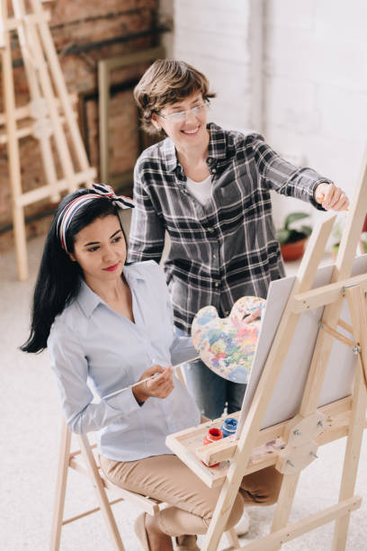 istock Young Woman in Art Class 1039587218
