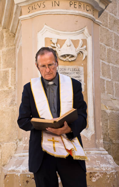 istock Priest reading the Bible 103958722