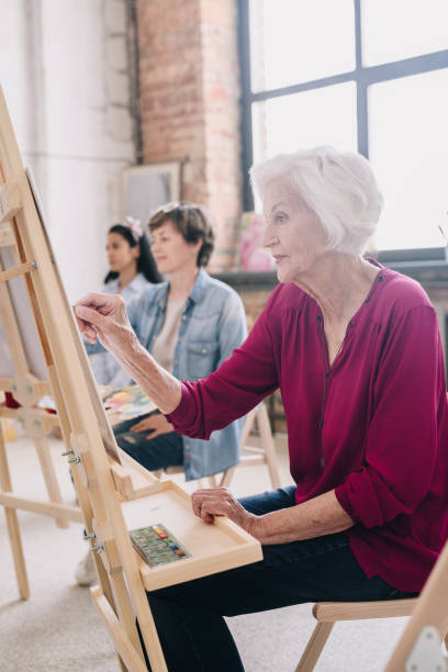 istock Artists Sitting in Row in  Studio 1039587230