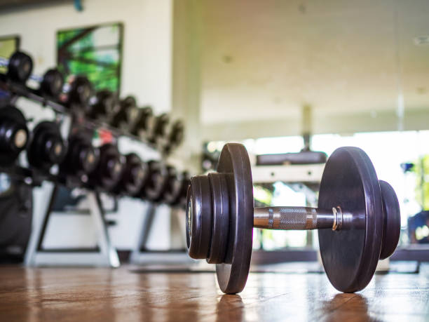 istock Dumbbells on the gym floor 1039591066