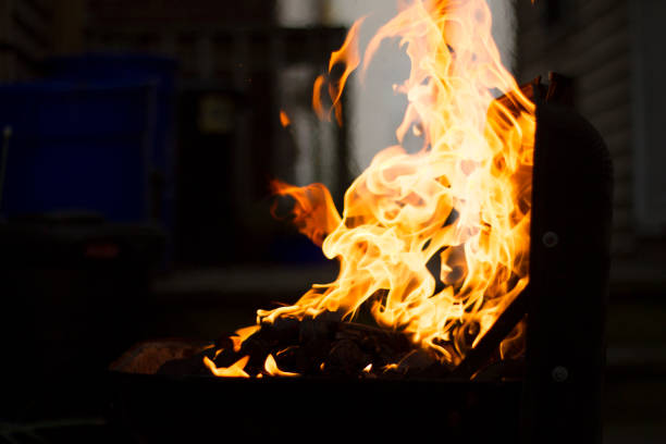 istock Preparing Charcoal For BBQ, Flames Shooting From Grill 1039597250