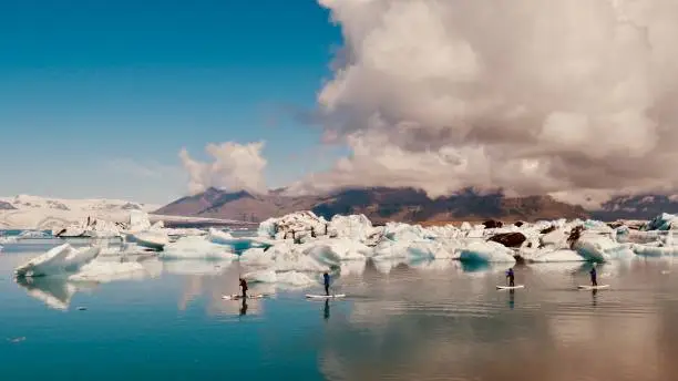 Padle surf in Jökulsárlón glacier. Iceland