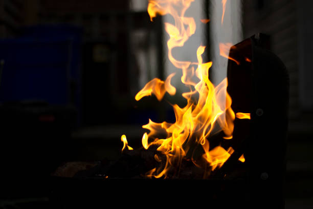 istock Preparing Charcoal For BBQ, Flames Shooting From Grill 1039600108