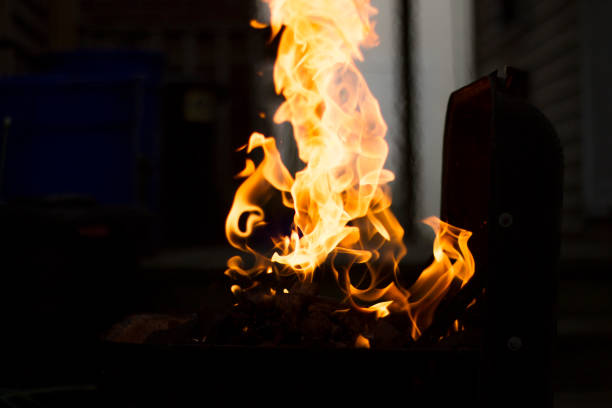 istock Preparing Charcoal For BBQ, Flames Shooting From Grill 1039600630