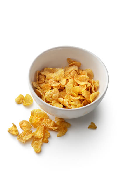 istock Breakfast Ingredients: Cornflakes Isolated on White Background 1039610802