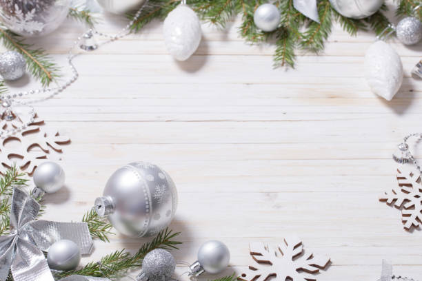 istock Silver Christmas decoration on wooden background 1039616564