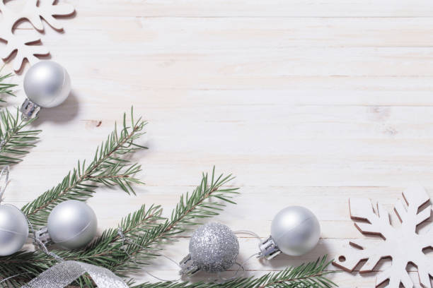 istock Silver Christmas decoration on wooden background 1039616578