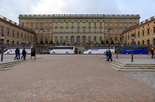 Stockholm, Sweden - Dec 9, 2017: People visit Royal Palace in Stockholm, Sweden. The baroque building was completed in 1760.