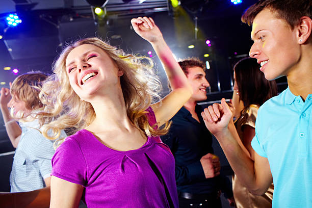 istock Group of active teens dancing together 103962129
