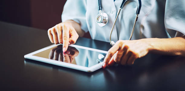 istock Doctor working on a digital tablet with copy space 1039629748