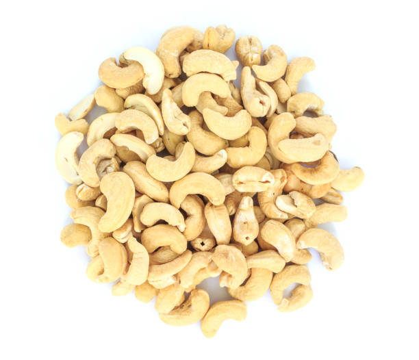 istock heap cashews top view on white background. 1039636630