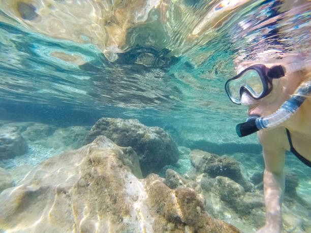 istock Young woman diving underwater 1039639602
