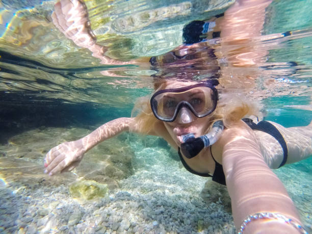 istock Young woman diving underwater 1039639640