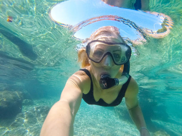 istock Young woman diving underwater 1039639820