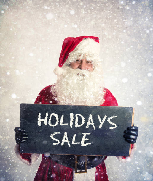 istock Santa Claus holding board with the sign 1039641052