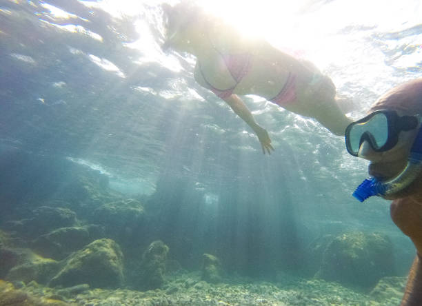 istock Young couple diving underwater 1039641116