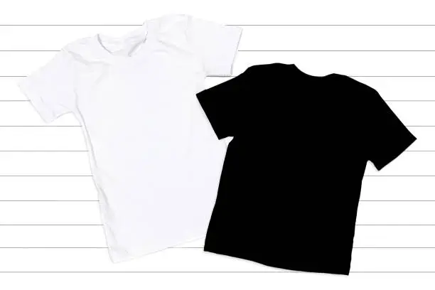 Black and White T-shirts Mockup - Flat Lay on a White Wooden Background