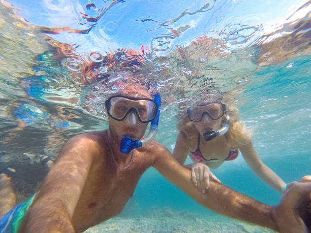 istock Young couple diving underwater 1039641706