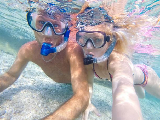 istock Young couple diving underwater 1039641720
