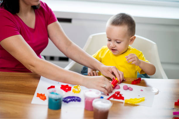 istock Mom and son with clay dough 1039647232