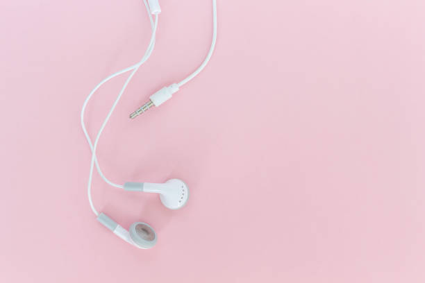 istock earbuds or earphones on pink background 1039648400