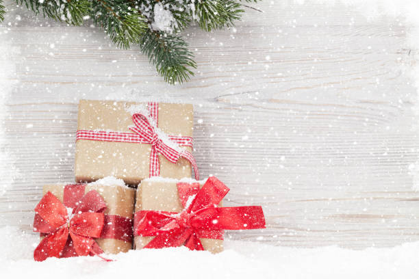istock Christmas gift boxes and fir tree branch 1039661758
