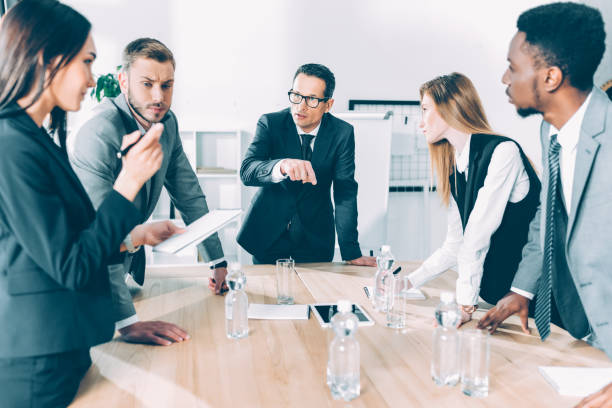 istock multiethnic businesspeople having conversation in conference hall 1039664096