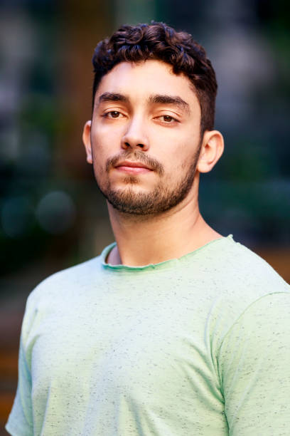 istock Young man seriously looking at the camera 1039682798