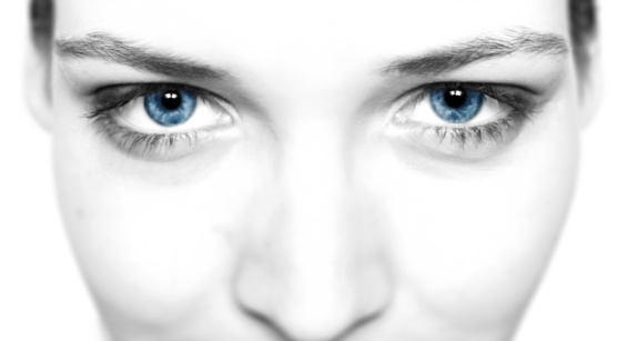 Close up - portrait shot of a young woman with blue eyes