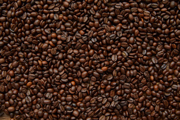 Coffee Beans Full frame Coffee Beans background raw coffee bean stock pictures, royalty-free photos & images