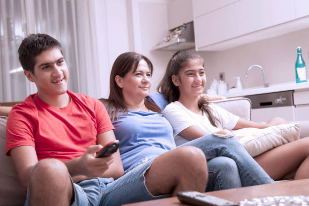 istock family watching tv 1039709050