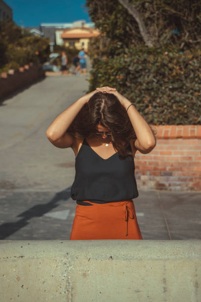 istock woman in her thirties stretching her neck down 1039714502