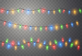 Christmas lights. Colorful bright Xmas garland. Vector red, yellow, blue and green glow light bulbs