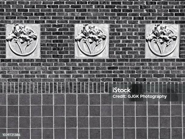 Concrete 3 Flowers On Red Brick Wall Bw Stock Photo - Download Image Now - Abstract, Architecture, Art