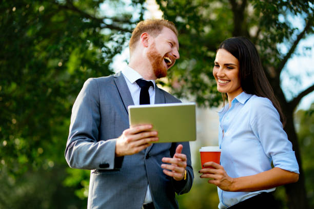 istock Business people smiling on a coffee break 1039722550