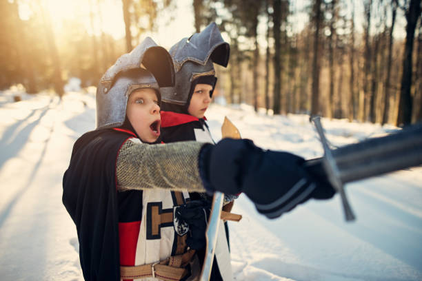istock Little knights on a quest in winter forest 1039727690
