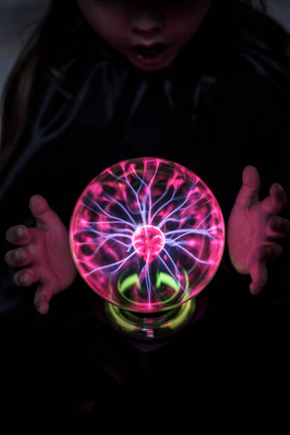 istock Little fortune teller with a plasma ball 1039733156