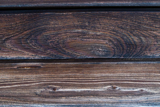 istock two parallel boards dark weather-beaten with natural wood pattern base rustic eco base dark 1039734158
