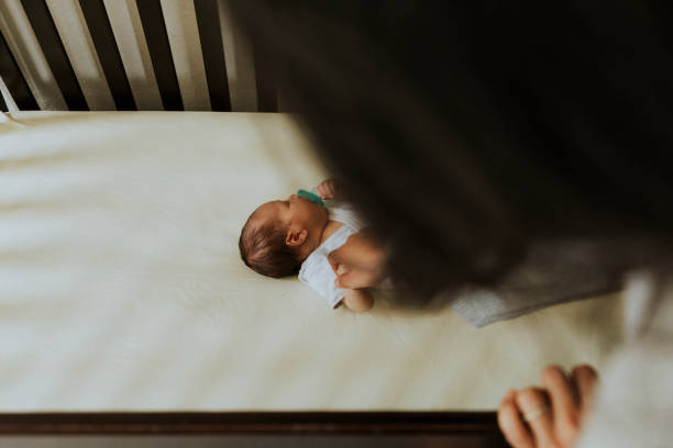istock Mother looking after a sleeping baby 1039736844