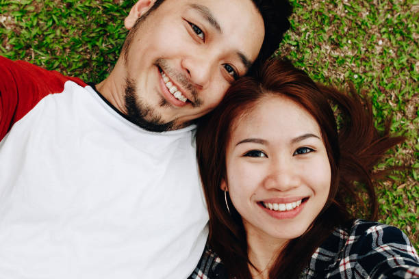 istock Couple taking a selfie in the grass 1039743578