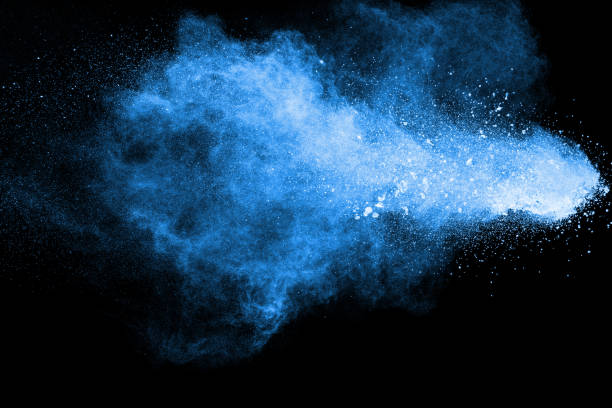 istock abstract blue dust explosion on  black background ,abstract blue powder splattered on black background , Freeze motion of blue powder exploding. 1039760314