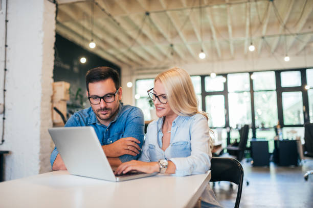 istock Two business partners discussing project over a laptop. 1039765504