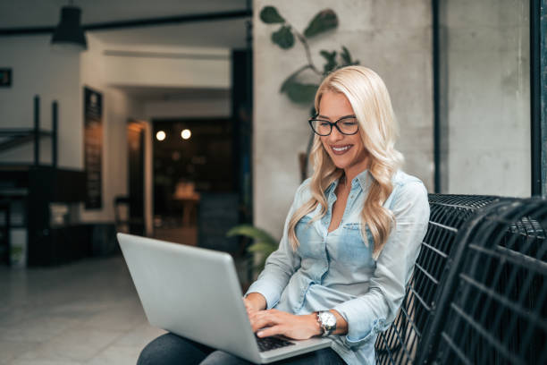 istock Beautiful blogger working while sitting in the lobby. 1039765526