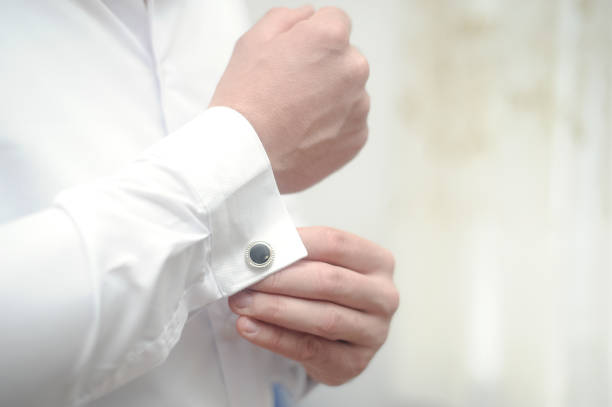 istock Man buckles his shirt 1039766326