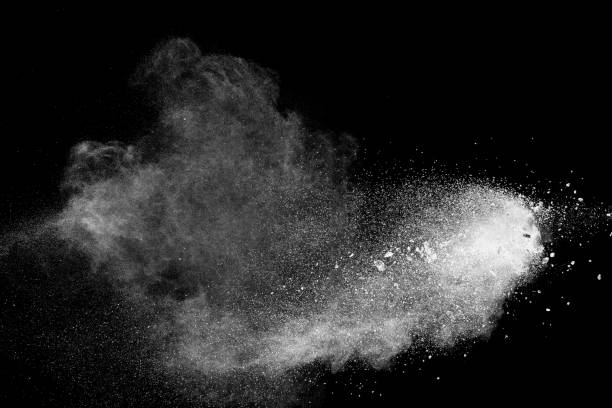 istock White talcum powder explosion splashing on black background. Use for web design or billboards abtract background. 1039769612