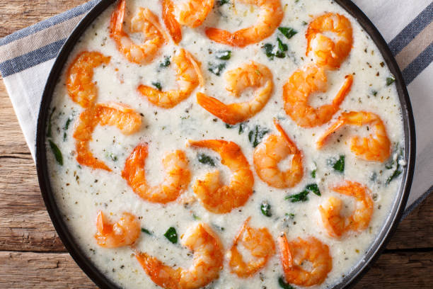 istock creamy garlic butter tuscan shrimp with spinach macro. Horizontal top view 1039773032
