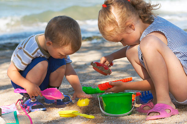 istock children play on beach 103977613