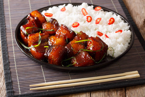 istock Vietnamese spicy caramel pork belly with rice closeup on a table. horizontal 1039788988