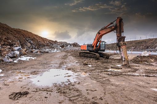 Outdoor quarry with heavy machinery or road construction