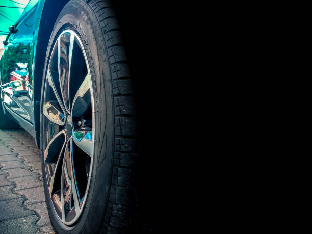 istock Modern car wheel background with reflection of a residence and space for text 1039797084